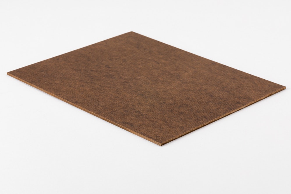 A masonite photo print mounting sample on a light gray background